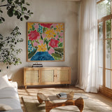 Floral Gift I by Courtney Prahl. Shown in a natural wood frame in a cozy modern living room. Available as an archival giclee rolled canvas, fine art paper, or poster print. SKU 103367a.