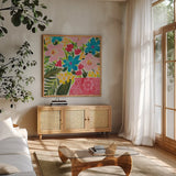 Floral Gift II by Courtney Prahl. Shown in a natural wood frame in a cozy modern living room. Available as an archival giclee rolled canvas, fine art paper, or poster print. SKU 103368a.