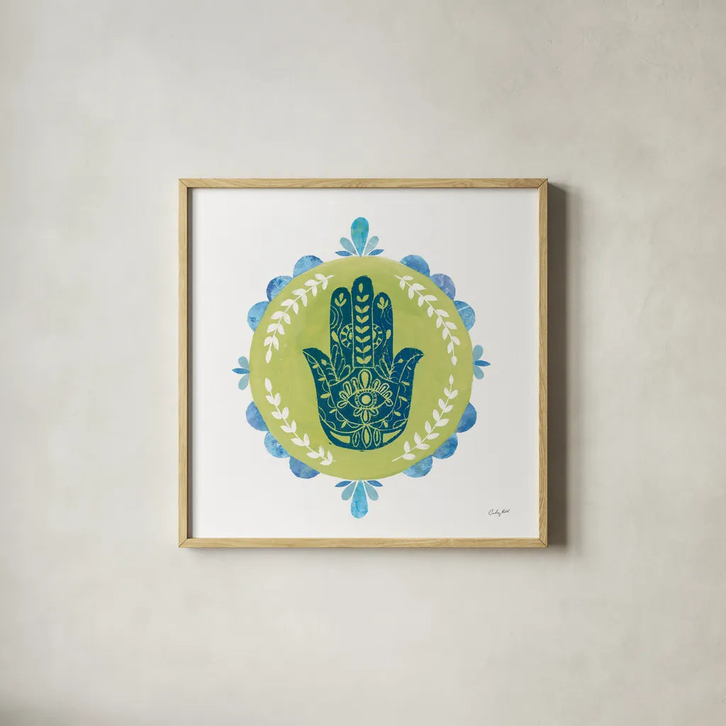 Hamsa Mandala II by Courtney Prahl. Shown in a natural wood glass frame for a timeless modern aesthetic. Available as an archival giclee rolled canvas, fine art paper, or poster print. SKU 76298a.