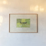 Hope Collage by Courtney Prahl. shown as a paper print in a natural frame. Available as a archival giclee rolled canvas, fine art paper, or poster print. SKU 52561i.