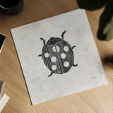 Ladybug Stamp BW by Courtney Prahl. Shown as a detailed flat fine art print, highlighting archival giclee quality. Available as an archival giclee rolled canvas, fine art paper, or poster print. SKU 54281a.