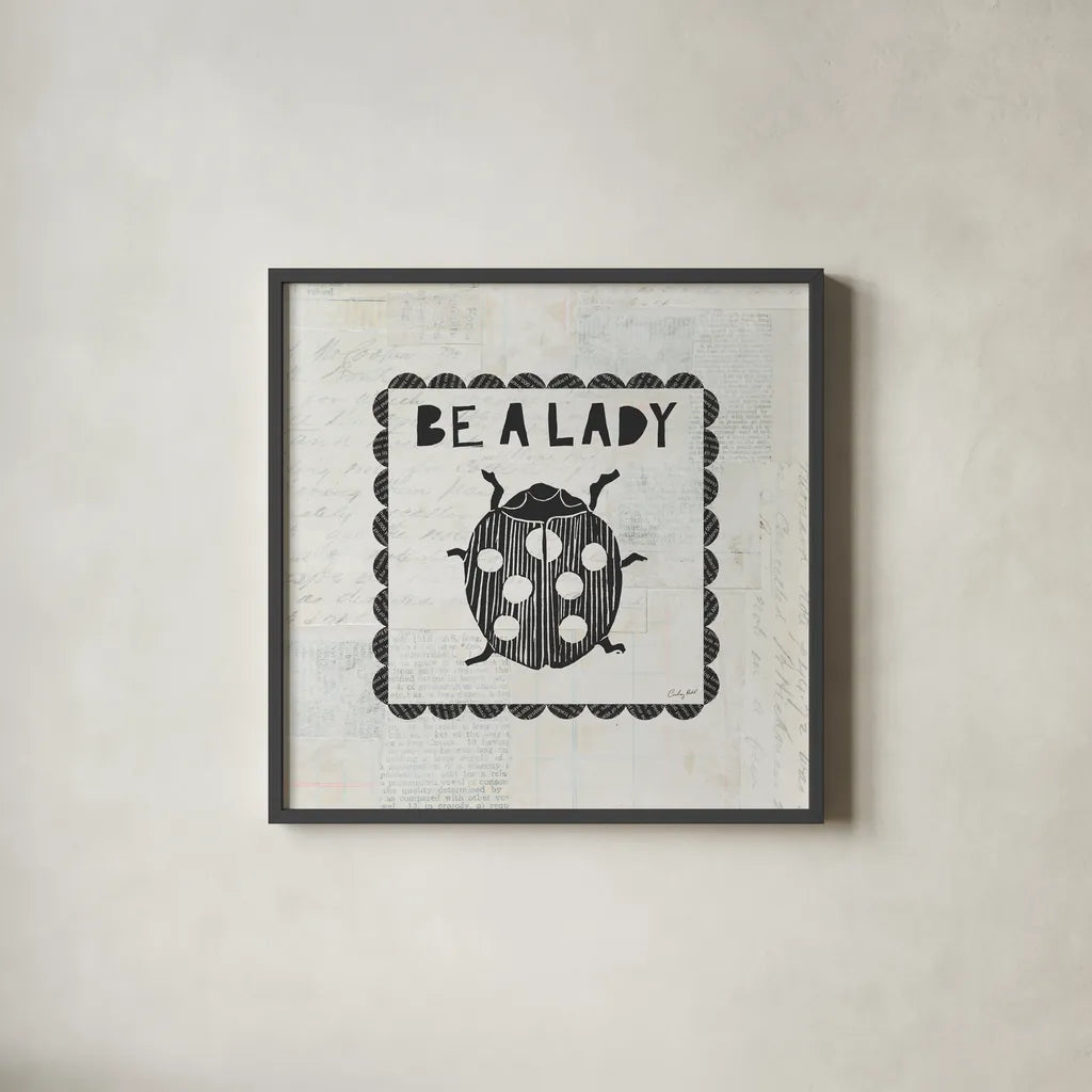 Ladybug Stamp Be A Lady by Courtney Prahl. Shown in a sleek black glass frame for a contemporary gallery look. Available as an archival giclee rolled canvas, fine art paper, or poster print. SKU 52084a.