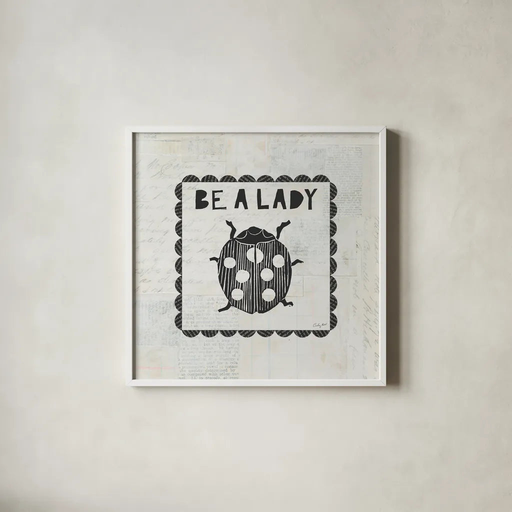 Ladybug Stamp Be A Lady by Courtney Prahl. Shown in a crisp white glass frame for a clean and minimalist style. Available as an archival giclee rolled canvas, fine art paper, or poster print. SKU 52084a.
