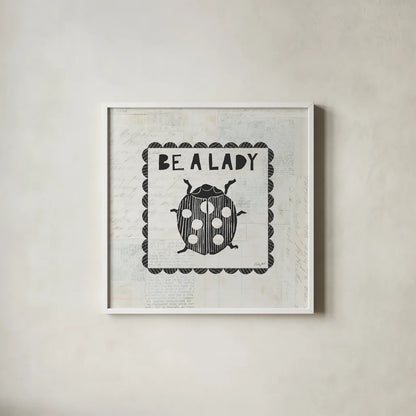 Ladybug Stamp Be A Lady by Courtney Prahl. Shown in a crisp white glass frame for a clean and minimalist style. Available as an archival giclee rolled canvas, fine art paper, or poster print. SKU 52084a.