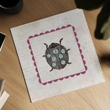 Ladybug Stamp Bright by Courtney Prahl. Shown as a detailed flat fine art print, highlighting archival giclee quality. Available as an archival giclee rolled canvas, fine art paper, or poster print. SKU 42871a.