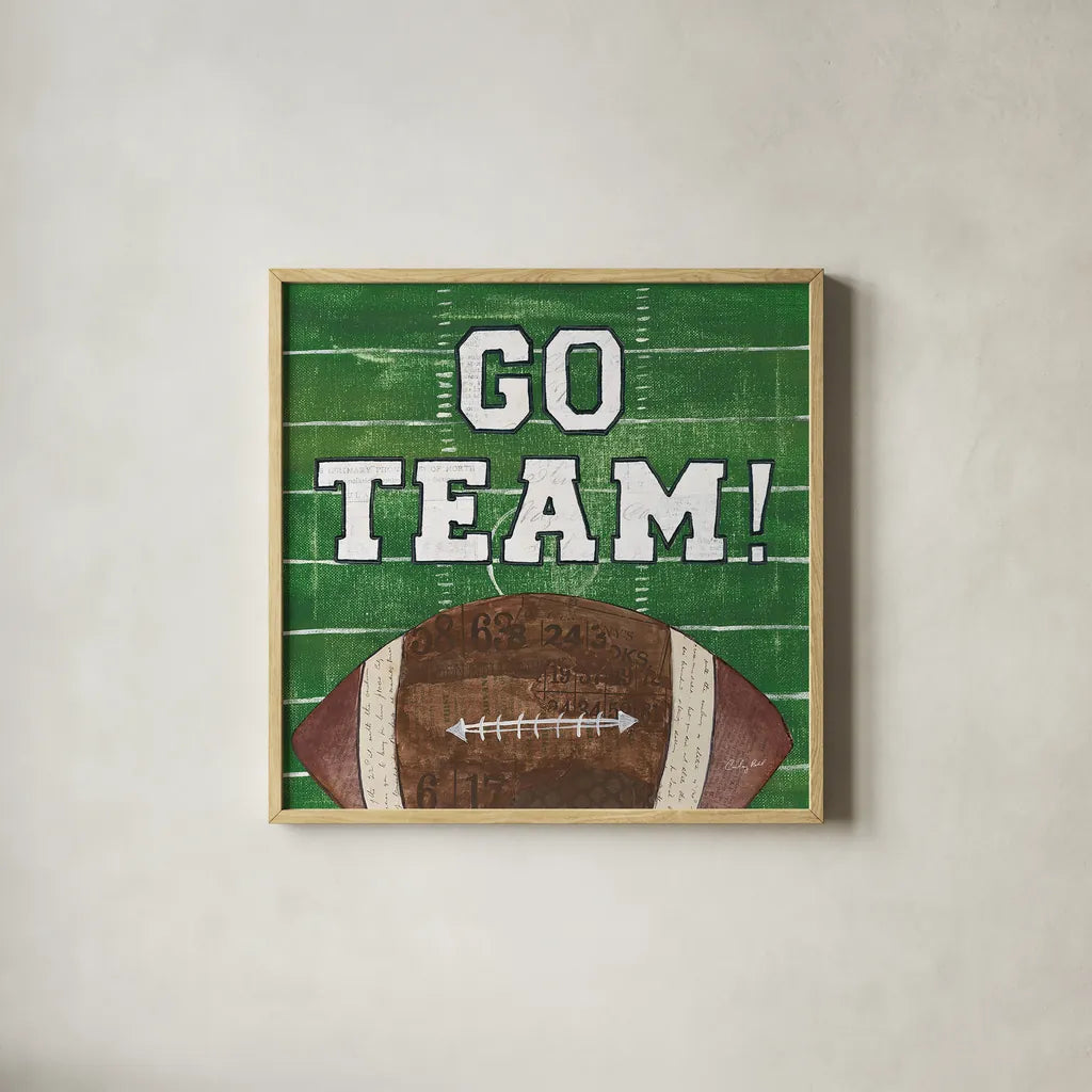 On the Field I Go Team by Courtney Prahl. Shown in a natural wood glass frame for a timeless modern aesthetic. Available as an archival giclee rolled canvas, fine art paper, or poster print. SKU 32958a.