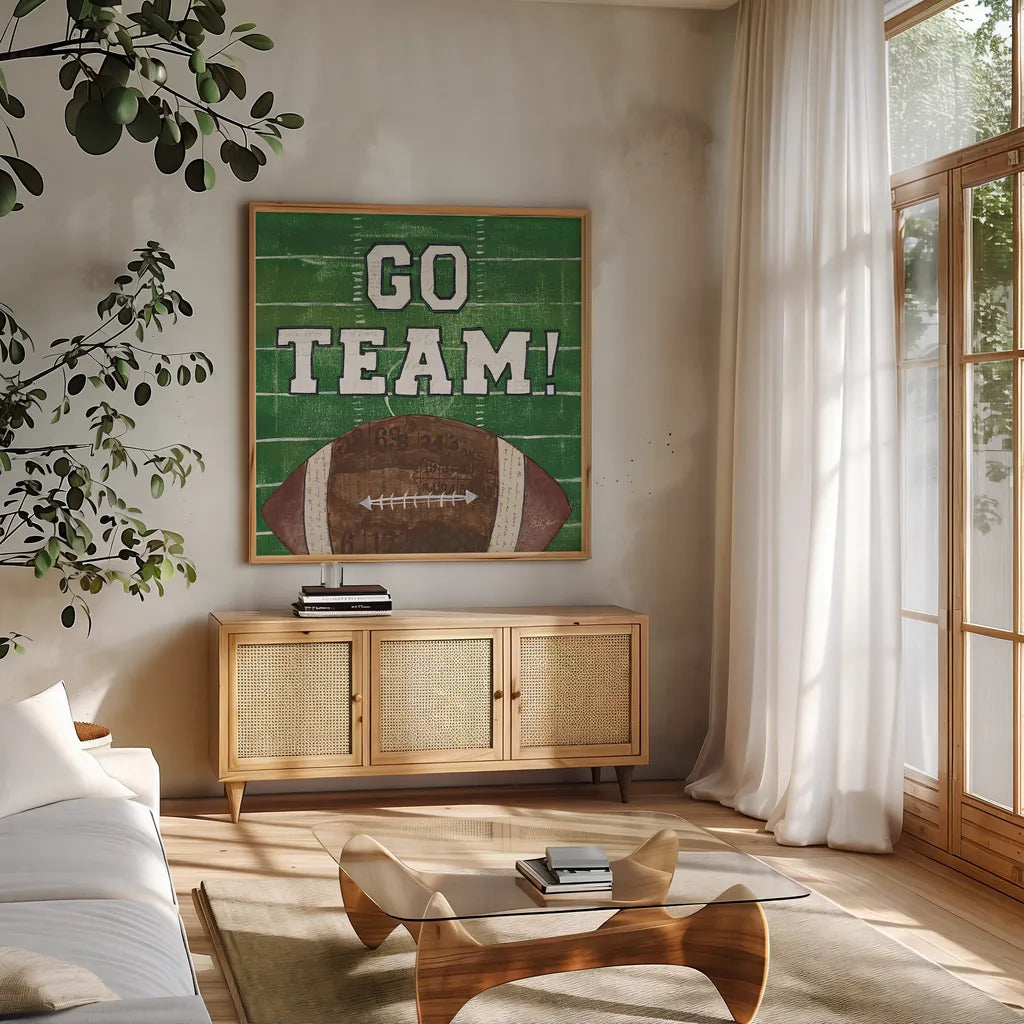 On the Field I Go Team by Courtney Prahl. Shown in a natural wood frame in a cozy modern living room. Available as an archival giclee rolled canvas, fine art paper, or poster print. SKU 32958a.