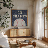 On the Field III Go Champs by Courtney Prahl. Shown in a natural wood frame in a cozy modern living room. Available as an archival giclee rolled canvas, fine art paper, or poster print. SKU 32960a.
