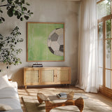 On the Field IV by Courtney Prahl. Shown in a natural wood frame in a cozy modern living room. Available as an archival giclee rolled canvas, fine art paper, or poster print. SKU 31726a.