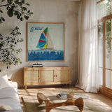 Rainbow Spinnakers III by Courtney Prahl. Shown in a natural wood frame in a cozy modern living room. Available as an archival giclee rolled canvas, fine art paper, or poster print. SKU 37518a.