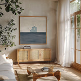 Rural Simplicity IV Blue by Courtney Prahl. Shown in a natural wood frame in a cozy modern living room. Available as an archival giclee rolled canvas, fine art paper, or poster print. SKU 80507a.