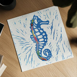 Sea Creature Seahorse Color Square by Courtney Prahl. Shown as a detailed flat fine art print, highlighting archival giclee quality. Available as an archival giclee rolled canvas, fine art paper, or poster print. SKU 13927a.