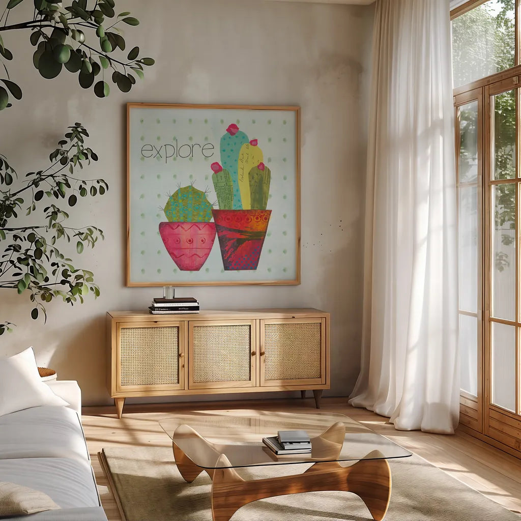 Southwest Cactus I by Courtney Prahl. Shown in a natural wood frame in a cozy modern living room. Available as an archival giclee rolled canvas, fine art paper, or poster print. SKU 37389a.