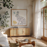 Spring Has Sprung IV by Courtney Prahl. Shown in a natural wood frame in a cozy modern living room. Available as an archival giclee rolled canvas, fine art paper, or poster print. SKU 43718a.