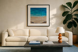 The Cove by Courtney Prahl. Displayed in a glass frame with matte in a clean modern living room. Available as an archival giclee rolled canvas, fine art paper, or poster print. SKU 90055a.