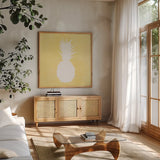 Tropical Fun Pineapple Silhouette II by Courtney Prahl. Shown in a natural wood frame in a cozy modern living room. Available as an archival giclee rolled canvas, fine art paper, or poster print. SKU 35712a.