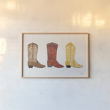 Western Cowgirl Boot VII by Courtney Prahl. shown as a paper print in a natural frame. Available as a archival giclee rolled canvas, fine art paper, or poster print. SKU 81379i.