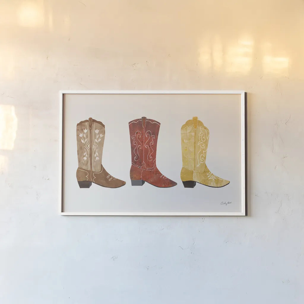 Western Cowgirl Boot VII by Courtney Prahl. shown as a paper print in a white frame. Available as a archival giclee rolled canvas, fine art paper, or poster print. SKU 81379i.