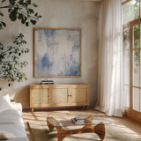 White Out I by Courtney Prahl. Shown in a natural wood frame in a cozy modern living room. Available as an archival giclee rolled canvas, fine art paper, or poster print. SKU 64279a.