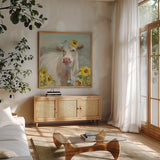 A Cow in a Crown by Danhui Nai. Shown in a natural wood frame in a cozy modern living room. Available as an archival giclee rolled canvas, fine art paper, or poster print. SKU 70498a.
