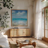 Across the Sea by Danhui Nai. Shown in a natural wood frame in a cozy modern living room. Available as an archival giclee rolled canvas, fine art paper, or poster print. SKU 66543a.