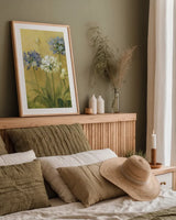 Agapanthus II by Danhui Nai. shown as a paper print in a natural frame. Available as a archival giclee rolled canvas, fine art paper, or poster print. SKU 5199h.