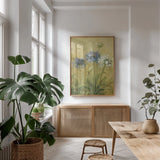 Agapanthus III by Danhui Nai. shown as a print in a natural wood frame in a dining room. Available as a archival giclee rolled canvas, fine art paper, or poster print. SKU 5200h.