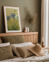 Agapanthus III by Danhui Nai. shown as a paper print in a natural frame. Available as a archival giclee rolled canvas, fine art paper, or poster print. SKU 5200h.