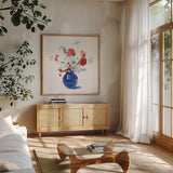 Americana Bouquet by Danhui Nai. Shown in a natural wood frame in a cozy modern living room. Available as an archival giclee rolled canvas, fine art paper, or poster print. SKU 85889a.
