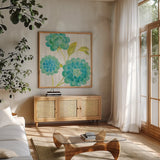 Aqua Blooms on Wood II by Danhui Nai. Shown in a natural wood frame in a cozy modern living room. Available as an archival giclee rolled canvas, fine art paper, or poster print. SKU 92015a.