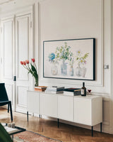 Beach Flowers I by Danhui Nai. shown as a framed stretched canvas in a living room above a console. Available as a archival giclee rolled canvas, fine art paper, or poster print. SKU 44418i.