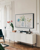Beach Flowers I Shiplap by Danhui Nai. shown as a framed stretched canvas in a living room above a console. Available as a archival giclee rolled canvas, fine art paper, or poster print. SKU 44431i.