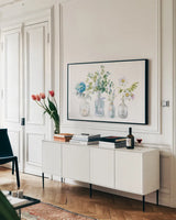 Beach Flowers I no coral by Danhui Nai. shown as a framed stretched canvas in a living room above a console. Available as a archival giclee rolled canvas, fine art paper, or poster print. SKU 80141i.