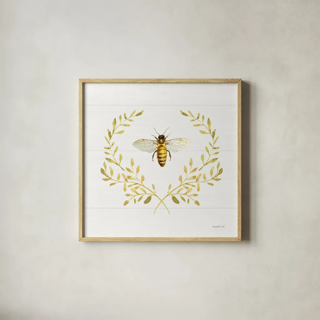 Bees and Blooms Bee Laurel by Danhui Nai. Shown in a natural wood glass frame for a timeless modern aesthetic. Available as an archival giclee rolled canvas, fine art paper, or poster print. SKU 78403a.