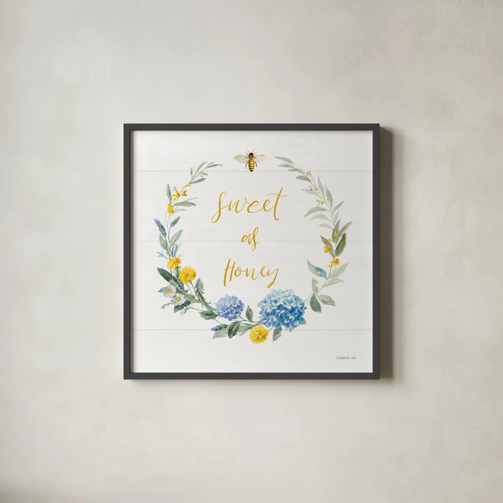 Bees and Blooms_Sweet As Honey Wreath by Danhui Nai. Shown in a sleek black glass frame for a contemporary gallery look. Available as an archival giclee rolled canvas, fine art paper, or poster print. SKU 78406a.