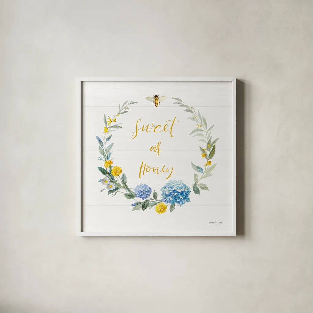 Bees and Blooms_Sweet As Honey Wreath by Danhui Nai. Shown in a crisp white glass frame for a clean and minimalist style. Available as an archival giclee rolled canvas, fine art paper, or poster print. SKU 78406a.