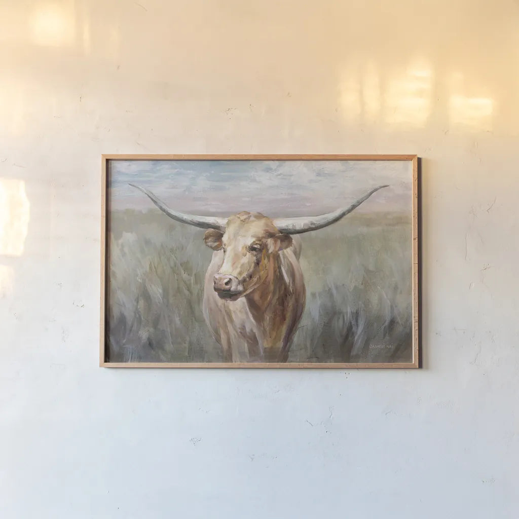 Big Sky Longhorn Sunset by Danhui Nai. shown as a paper print in a natural frame. Available as a archival giclee rolled canvas, fine art paper, or poster print. SKU 76005i.