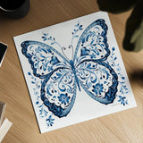 Blue Butterfly II by Danhui Nai. Shown as a detailed flat fine art print, highlighting archival giclee quality. Available as an archival giclee rolled canvas, fine art paper, or poster print. SKU 99153a.