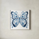 Blue Butterfly II by Danhui Nai. Shown in a crisp white glass frame for a clean and minimalist style. Available as an archival giclee rolled canvas, fine art paper, or poster print. SKU 99153a.