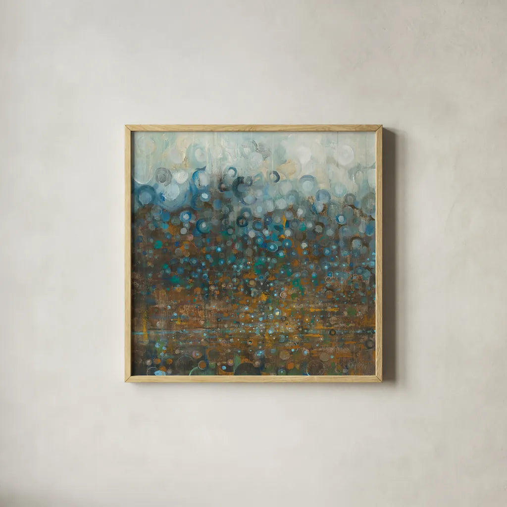 Blue and Bronze Dots by Danhui Nai. Shown in a natural wood glass frame for a timeless modern aesthetic. Available as an archival giclee rolled canvas, fine art paper, or poster print. SKU 28386a.