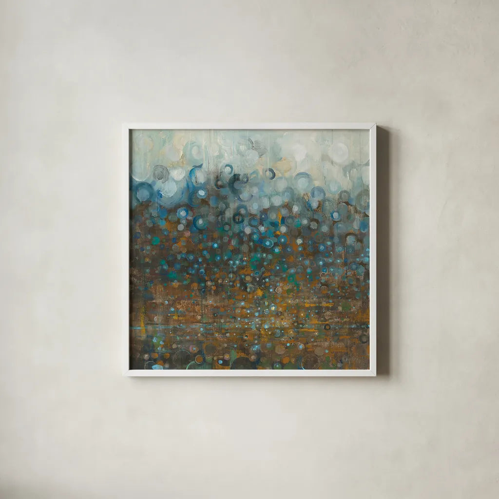 Blue and Bronze Dots by Danhui Nai. Shown in a crisp white glass frame for a clean and minimalist style. Available as an archival giclee rolled canvas, fine art paper, or poster print. SKU 28386a.