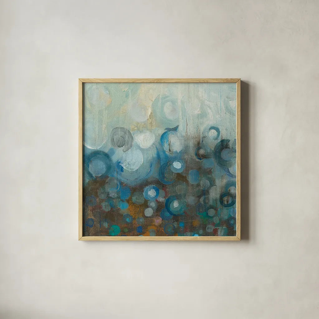Blue and Bronze Dots VII by Danhui Nai. Shown in a natural wood glass frame for a timeless modern aesthetic. Available as an archival giclee rolled canvas, fine art paper, or poster print. SKU 29769a.
