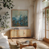 Blue and Bronze Dots VII by Danhui Nai. Shown in a natural wood frame in a cozy modern living room. Available as an archival giclee rolled canvas, fine art paper, or poster print. SKU 29769a.