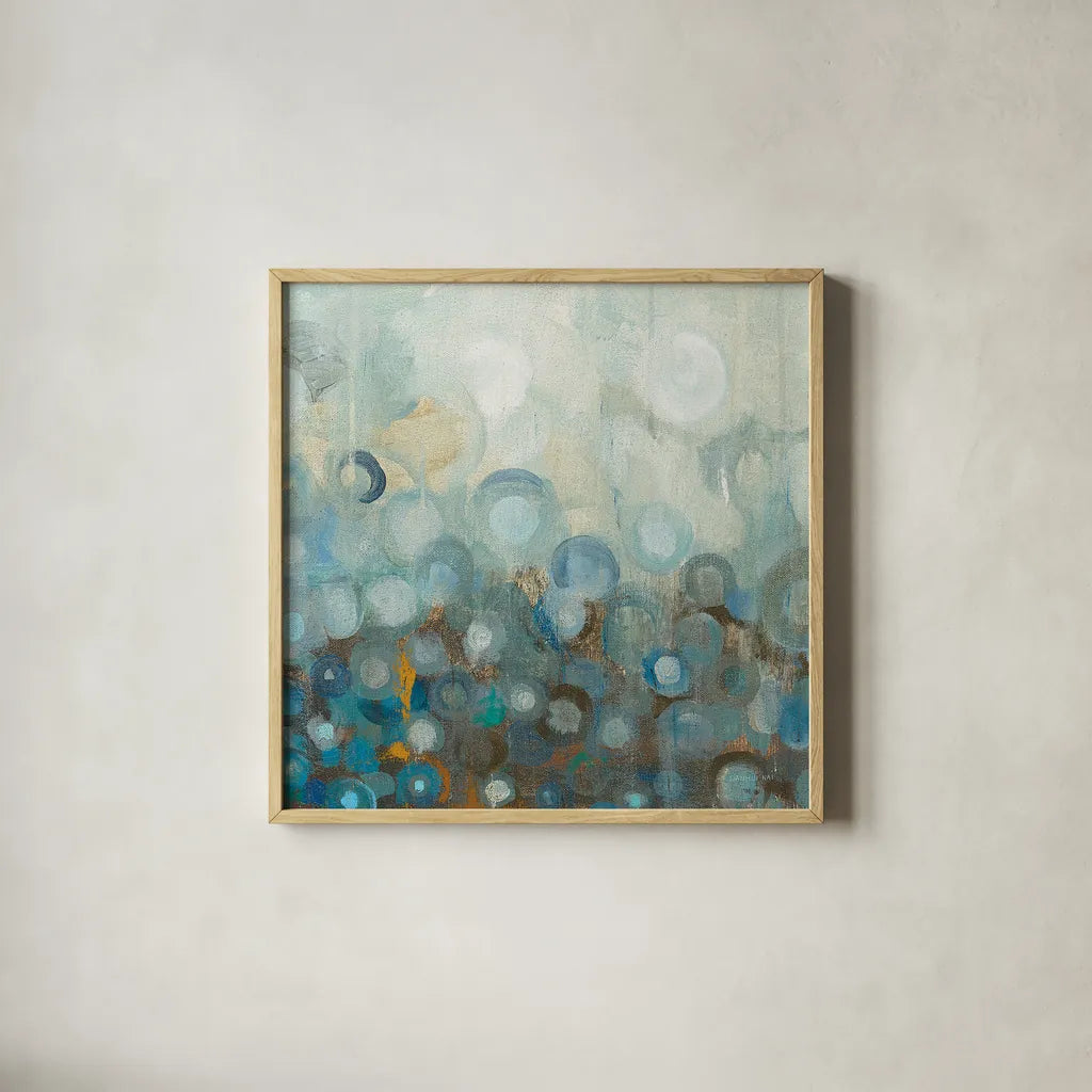 Blue and Bronze Dots VIII by Danhui Nai. Shown in a natural wood glass frame for a timeless modern aesthetic. Available as an archival giclee rolled canvas, fine art paper, or poster print. SKU 29770a.