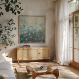 Blue and Bronze Dots VIII by Danhui Nai. Shown in a natural wood frame in a cozy modern living room. Available as an archival giclee rolled canvas, fine art paper, or poster print. SKU 29770a.