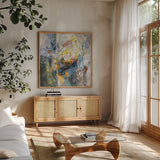 Blue and Sienna Abstract by Danhui Nai. Shown in a natural wood frame in a cozy modern living room. Available as an archival giclee rolled canvas, fine art paper, or poster print. SKU 69231a.