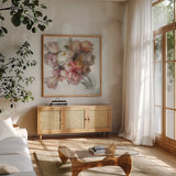 Blush Bouquet on White by Danhui Nai. Shown in a natural wood frame in a cozy modern living room. Available as an archival giclee rolled canvas, fine art paper, or poster print. SKU 89664a.