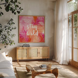 Boho Tropical Sign I by Danhui Nai. Shown in a natural wood frame in a cozy modern living room. Available as an archival giclee rolled canvas, fine art paper, or poster print. SKU 72050a.