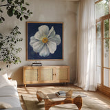 Boldest Bloom I Dark Blue by Danhui Nai. Shown in a natural wood frame in a cozy modern living room. Available as an archival giclee rolled canvas, fine art paper, or poster print. SKU 66621a.