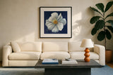 Boldest Bloom I Dark Blue by Danhui Nai. Displayed in a glass frame with matte in a clean modern living room. Available as an archival giclee rolled canvas, fine art paper, or poster print. SKU 66621a.